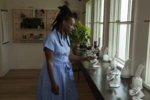 Woman shops for Cannabis flowers at dispensary